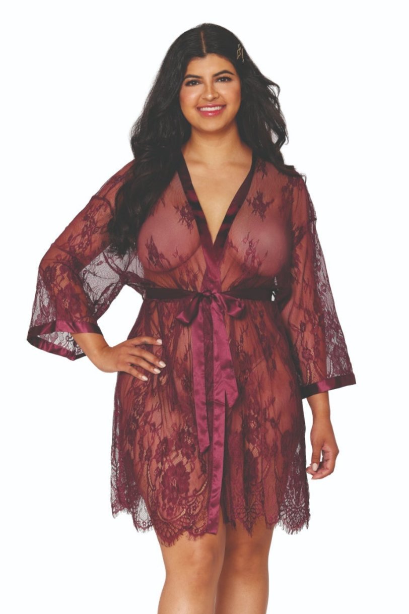 Woman in Playful Curvy Eyelash Lace Scallop Robe with scallop hem, satin banding, and attached belt, confidently showcasing stylish sleepwear.