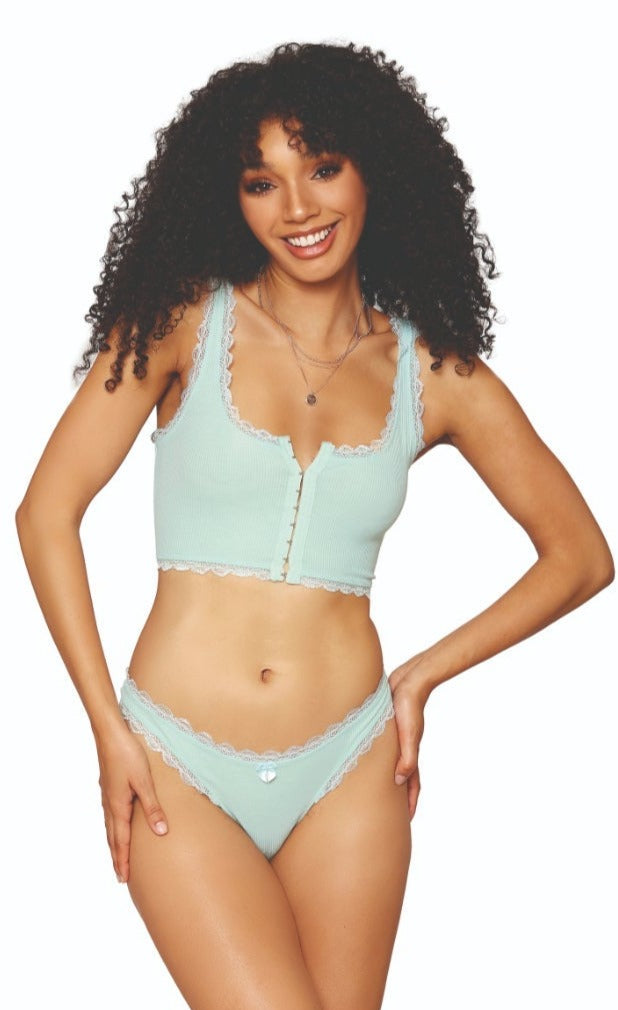 Woman modeling the Mint Sleepwear Bralette and Thong Set, featuring a rib knit design, lace trim bralette with front hook detail, and coordinating thong.