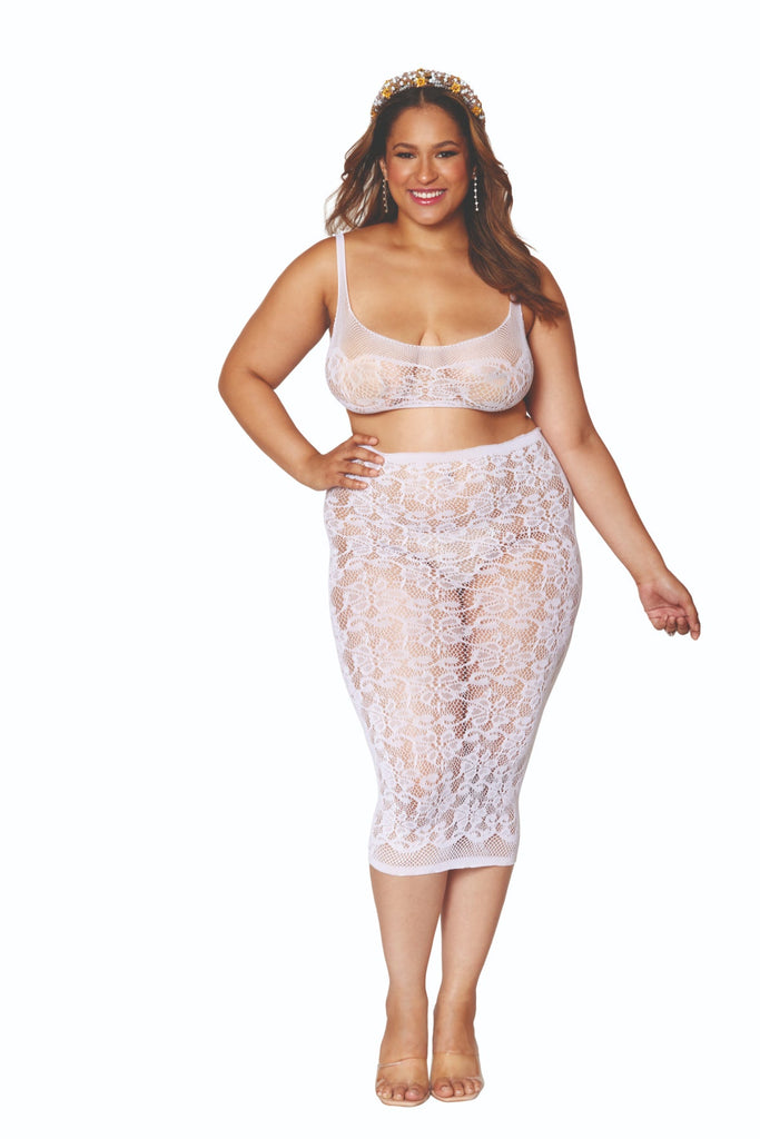 Woman in Plus Size Lace Bralette & Slip Skirt Lingerie Set, showcasing seamless sheer lace with crisscross back detail, smiling with a crown.