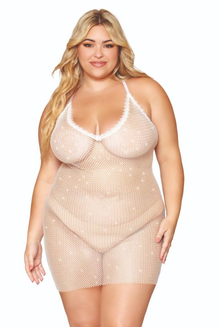 Woman modeling the Fabulous Sheer Plus Size Rhinestone Fishnet Chemise with eyelash lace trim and rhinestone accents, featuring adjustable crisscross shoulder straps for a customizable fit.