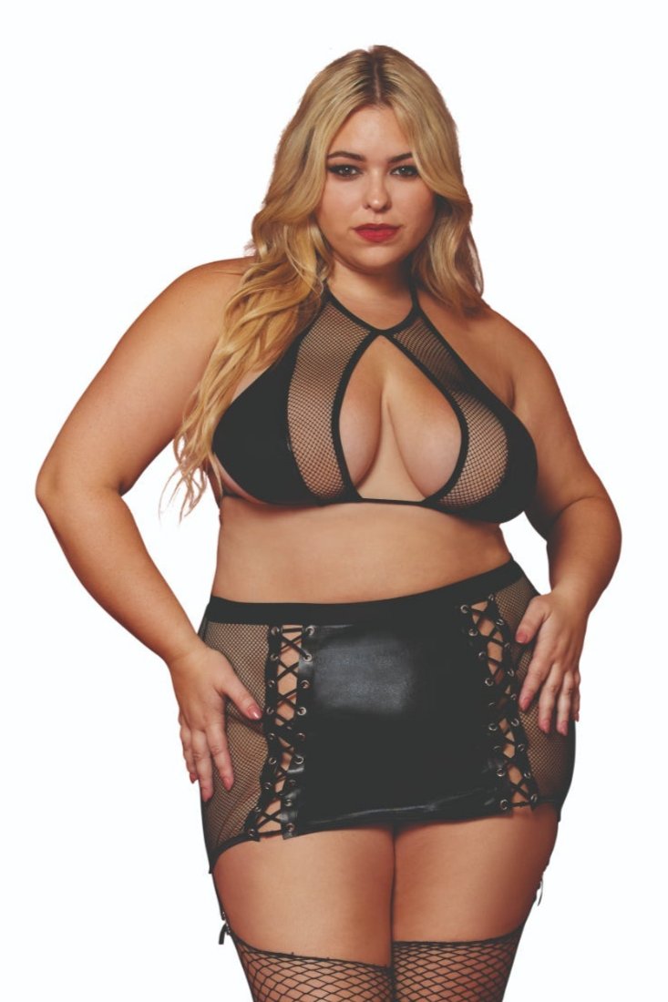 Woman modeling Plus Size Fishnet and Faux-Leather Bralette Skirt Set, featuring cutout bralette and lace-up garter skirt. Thigh highs and thong not included.