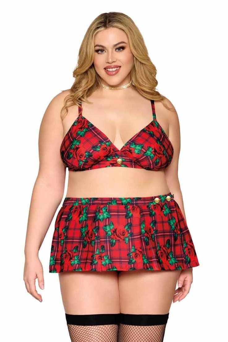 Woman models Plus Size Rose Plaid Bralette with Mini Skirt, showcasing festive plaid design, adjustable straps, gold button details, and versatile styling options.