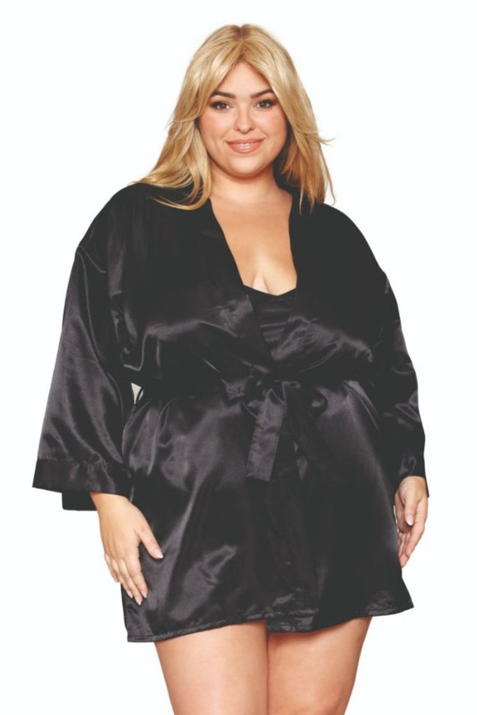 Plus size model in black satin robe and chemise set.