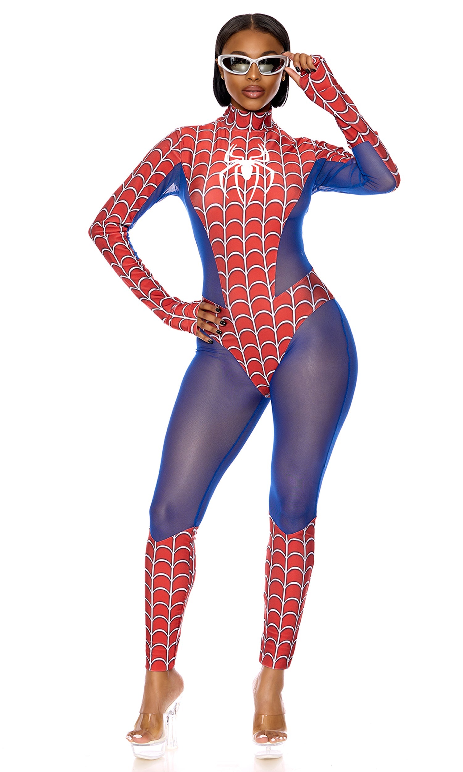 Woman wearing a Sexy Spider Woman Comic Book Halloween Costume, featuring a mockneck jumpsuit with screenprinted design, sheer mesh panels, and sunglasses for a superhero look.