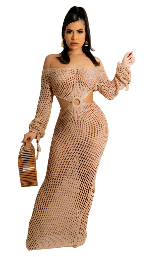 Woman modeling a Sexy Cover Up Sheer Crochet Dress with Tassels Sleeves, showcasing its beach style and intricate crochet pattern.