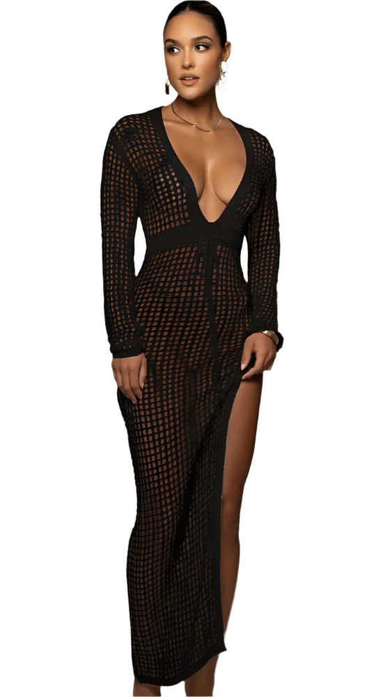 Woman in a black Sexy Cover Up Sheer Crochet Dress with Tassel Sleeves, showcasing a knitted beach style.