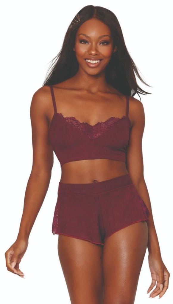 Woman modeling Cozy Rib Knit Bralette and Short Sleep Set with lace insets and adjustable straps, featuring high-waisted shorts with lace detail.