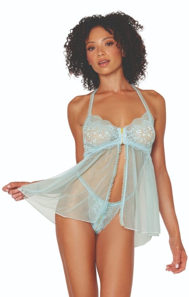 Woman modeling the Frilly Mint Lace and Mesh Babydoll Set, featuring scalloped lace cups, a front zipper, adjustable halter, and ruffled open front skirt.