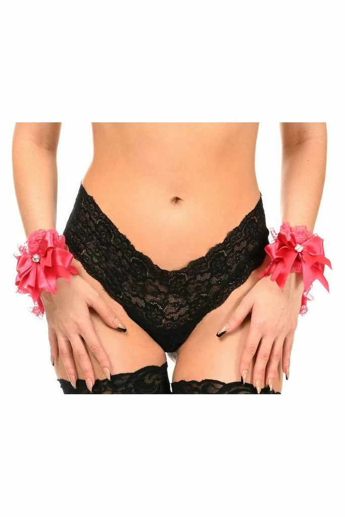 Woman modeling Sexy Fuchsia Lace Wristlets, a set of two, featuring rhinestone embellishments and an elastic back, worn with black underwear and pink bows.