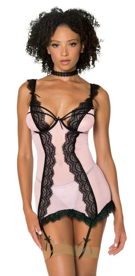 Woman wearing the Super Cute Black & Pink Diamond Slip Set, featuring lace trim, satin bows, underwire cups, and adjustable garters for pairing with thigh highs.